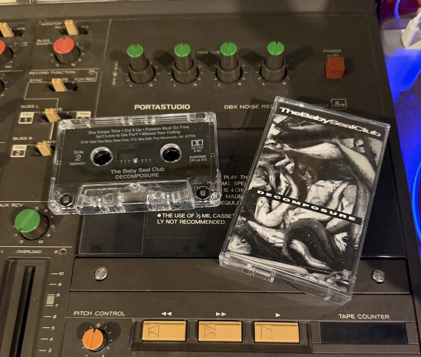 Original Decomposure cassette and case on a Tascam Portastudio